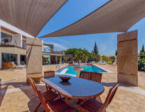 table, hotel, house, swimming pool, chair, coffee table, pool, building, resort, sky